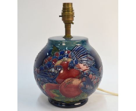 A Moorcroft contemporary table lamp, blue ground decorated with tube lined fruit and birds, 16 cm high excluding light fittin