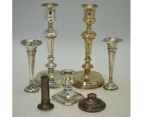 A pair of loaded silver baluster candlesticks, London 1913, 23 cm high, to/w a short candlestick, Birmingham 1912, a broken p