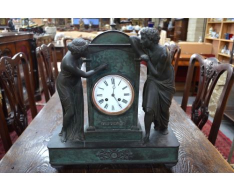 A 19th century French Empire style patinated bronze mantle clock with drum movement by Japy Freres, the case mounted with a m