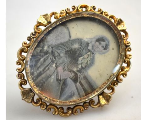 A 19th century Daguerrotype portrait of a lady, mounted in a gilt metal brooch