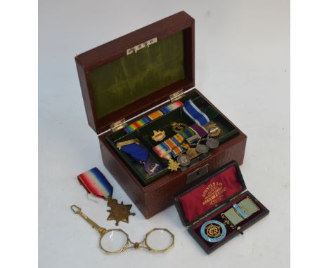 A leather-bound jewellery box containing various collectables including an unnamed group of five miniature medals - 1914 Star