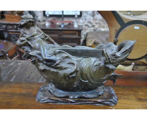 An Art Nouveau style bronzed spelter table centre piece cast with a sea-nymph with serpent, with tin flower trough liner, 50 