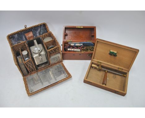 A fitted wicker picnic set, including kettle, to/w an electrotherapy machine, a resistance-tester and a Negretti & Zambra bra