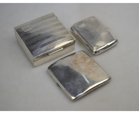 A silver cigarette box with engine-turned decoration, Birmingham 1933, to/w two cigarette cases (3)