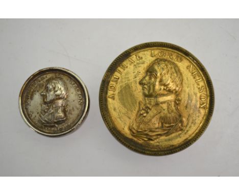 An early 19th century electroplated pill box commemorating the Death of Nelson, 3.5 cm, to/w a gilt brass snuff box, the cove