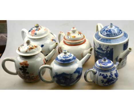A small Chinese blue and white teapot with domed cover and metal spout, 14 cm wide,  Kangxi; together with a Chinese Imari te