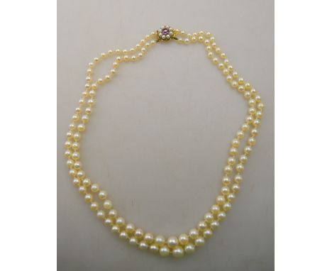 A double row graduated cultured pearl necklace on amethyst and split pearl three row cluster snap stamped 9ct