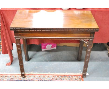 A late 18th/19th century Chinese Chippendale style mahogany card table, the rectangular fold-over top concealing a baize line