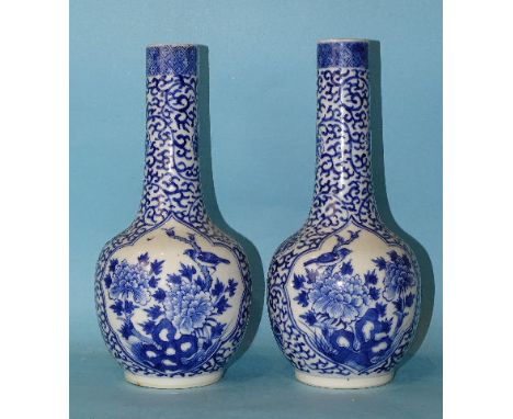 A pair of 19th century Chinese porcelain bottle vases decorated with panels of birds in branches, on a scroll-work ground, Ka