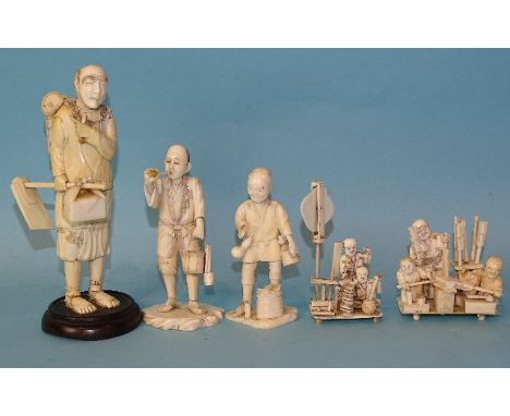 A Japanese ivory standing wood-cutter, a man smoking a pipe and three other small ivory groups, Meiji, (damages), (5).