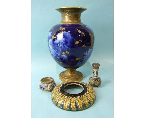 A Doulton Burslem baluster-shaped vase with gilt neck and base, the body with underglaze chrysanthemum decoration on blue gro