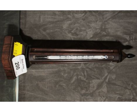 An African blackwood thermometer in the form of an obelisk, 21cm high