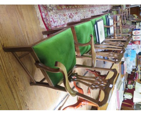 A set of four George III mahogany dining chairs, including two carvers, the pierced vase shape splats above drop in seats and