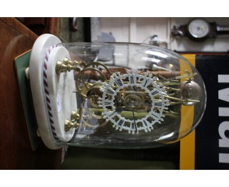 A Victorian brass skeleton clock, the triple lancet arch shaped frame with white painted dial, the single train fusee movemen