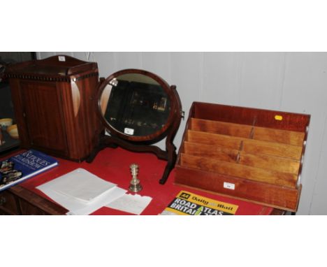 An Edwardian mahogany table top cabinet, the raised top with dentil moulding over a chevron banded panel door, 43cm high, 40.