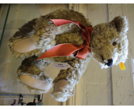 A Steiff teddy bear, no.000751, with ribbon tie