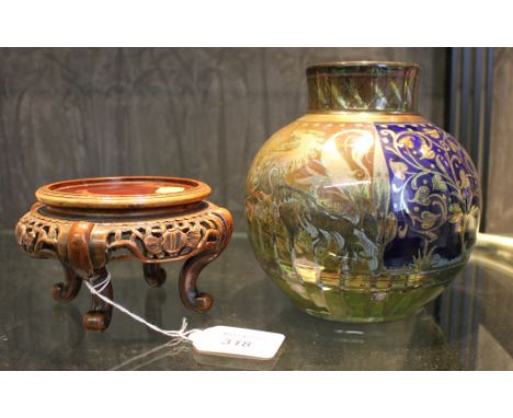 A Pilkingtons Royal Lancastrian lustre vase with blue panels depicting trees and brown panels depicting lions rampant, impres