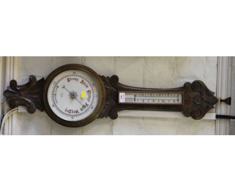 An Edwardian carved oak barometer, the dial inscribed J. Scott, Taunton, with mercury thermometer, 84cm high