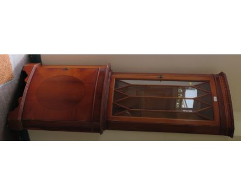 A yewwood veneer bowfront corner cabinet, the dentil cornice over a glazed door above an oval veneered cupboard door, 180cm h