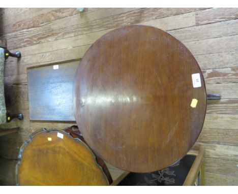 A 19th century mahogany tripod table, with circular snaptop, turned stem and downswept legs, 50cm diameter, and a nest of thr