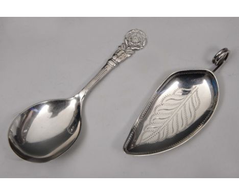 A CONTEMPORARY SILVER CADDY SPOON in the form of a leaf with engraved decoration, 8cm long, London 1980, makers mark B & H; a