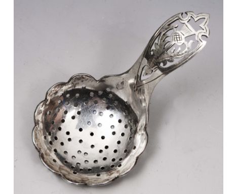 A SCOTTISH SILVER CADDY SPOON with drilled bowl and pierced handle decorated with a thistle, Edinburgh 1956 by Francis Howard