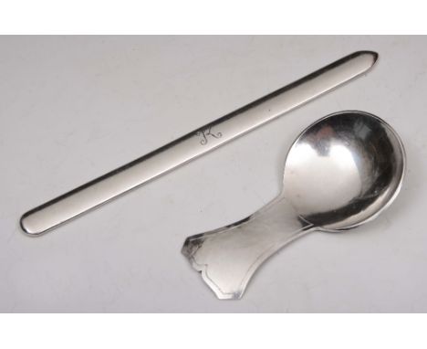 A HAND BEATEN SILVER CADDY SPOON with a hammered waisted handle, 8.5cm long by The Guild of Handicrafts 1975; and a plain let