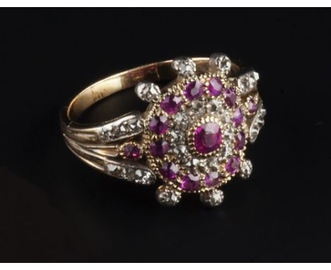 A LATE 18TH/EARLY 19TH CENTURY RUBY AND DIAMOND CLUSTER RING, the principal cushion-shaped ruby framed by a double row border