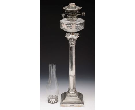 A SILVER OIL LAMP, large corinthian column on a square stepped base with beaded decoration, column 48cm high, with lamp and a