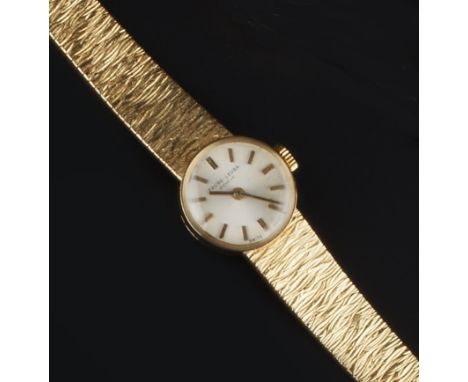 A LADY'S BRACELET WATCH BY FAVRE-LEUBA, the circular silvered dial with baton markers, to a manual wind movement and tapered 