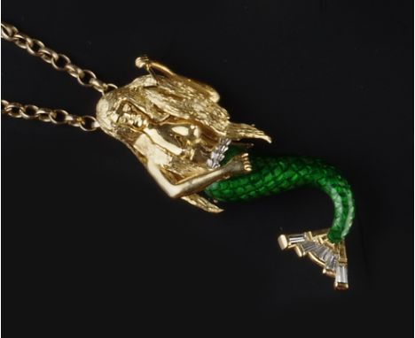AN ENAMEL AND DIAMOND SET PENDANT, modelled as a mermaid combing her hair, highlighted with green enamel below her waist and 