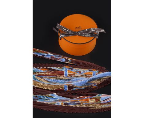 A 'L'ART INDIEN DES PLAINES' ACCORDION SILK SCARF BY HERMÈS, of geometric design, in shades of blue, red, orange and brown, s