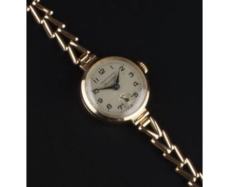 A LADY'S 9CT GOLD 'INCASTAR' BRACELET WATCH BY ERNEST BOREL, the circular signed silvered dial with Arabic numerals and subsi