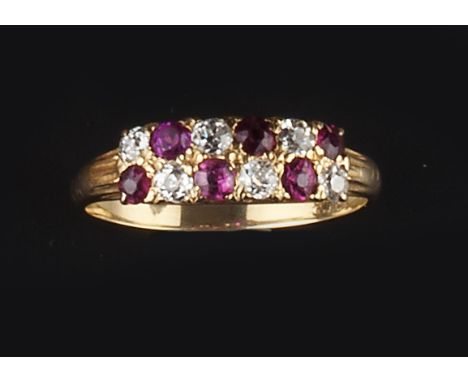 A RUBY AND DIAMOND HALF HOOP RING, alternately set with two rows of circular-cut rubies and old-cut diamonds, the yellow prec