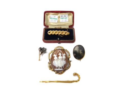 A Victorian 9ct gold brooch, designed as a walking stick, Birmingham 1894, an oval moss agate set brooch, a rose diamond set 