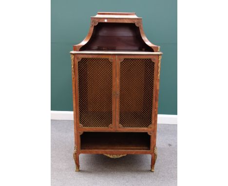 A 19th century French gilt metal mounted Kingwood side cabinet, with open shelf top over a pair of brass grille doors and fur