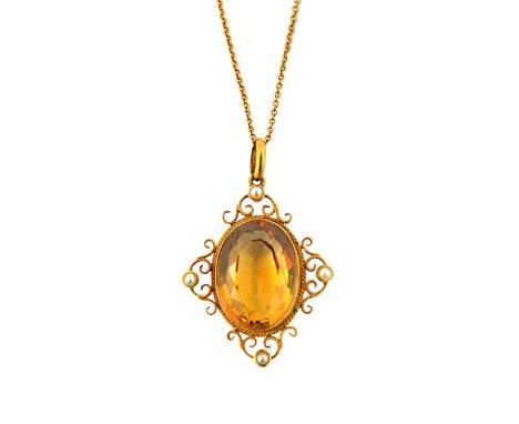A gold, citrine and half pearl set pendant, mounted with the oval cut citrine at the centre, within a scroll pierced surround