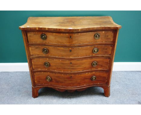 A George III inlaid cross-banded mahogany serpentine chest, the top fitted drawer over three further long graduated drawers, 