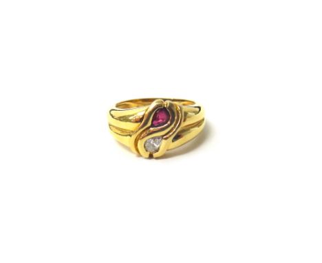 A gold, ruby and diamond set two stone ring, mounted with a pear shaped ruby and with a pear shaped diamond, in a twist over 