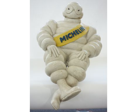 A Michelin 'Bibendum' man with metal mount to rear (57cm) and a Mercedes Benz vintage enamel circular sign, (40cm diam), (2).