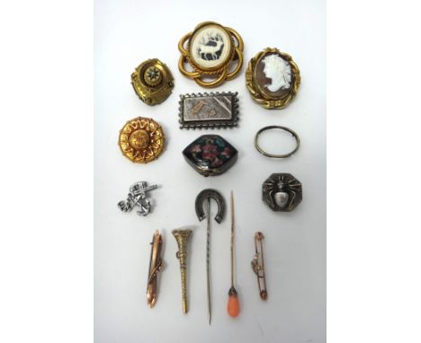 A Victorian gold shaped circular brooch, the back glazed with a locket compartment, two gold bar brooches, an oval shell came