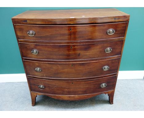 A Regency mahogany bowfront chest of four long graduated drawers, on splayed bracket feet, 59cm wide.