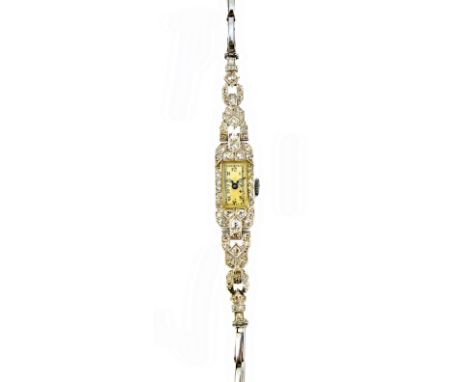 A lady's platinum cased and diamond set bracelet wristwatch, with an unsigned movement, the rectangular dial with black Arabi