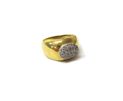 An Italian gold and diamond set oval cluster ring, mounted with small circular cut diamonds, detailed 18 K Italy, ring size L