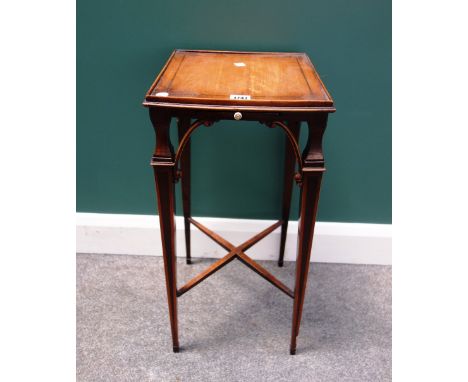 A George III mahogany kettle stand, the square top over candle slide on four waisted square supports, united by an 'X' frame 
