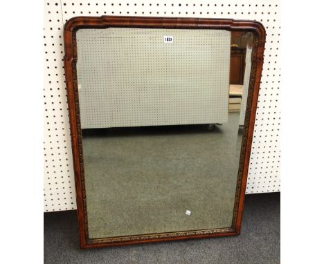An early 18th century style parcel gilt walnut arch top wall mirror with bevelled mirror plate, 72cm wide x 94cm high, togeth