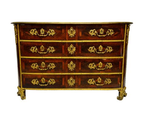 An early 18th century French ormolu mounted kingwood and rosewood parquetry inlaid bowfront commode with two short over three