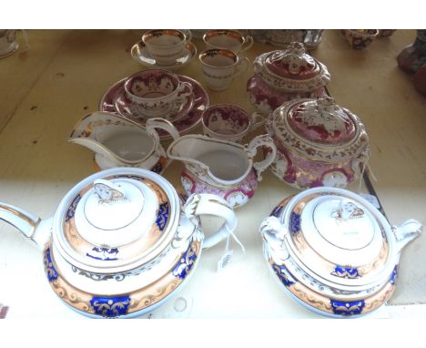 A Ridgway porcelain part tea service, 1820's, with butterfly knops, painted with gilt foliate bands on an apricot and deep bl