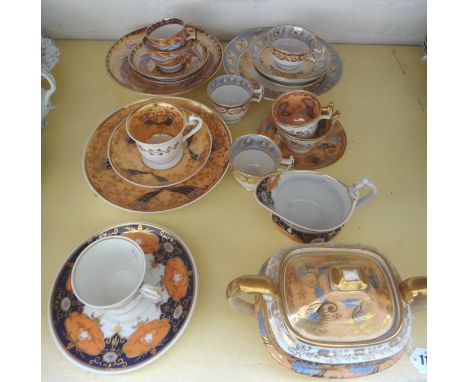 A group of Ridgway porcelain tea and coffee wares, circa 1820, in three patterns, each with rich foliate decoration on a salm