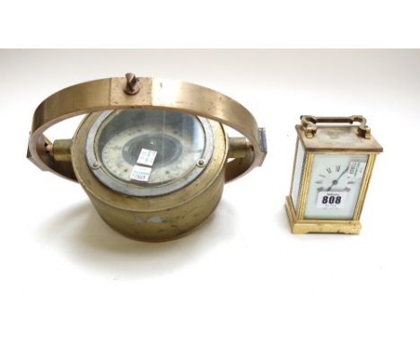 A brass cased carriage clock by Mappin & Webb, and a brass naval gimbal mounted compass (a.f), 16.5cm diameter. (2)